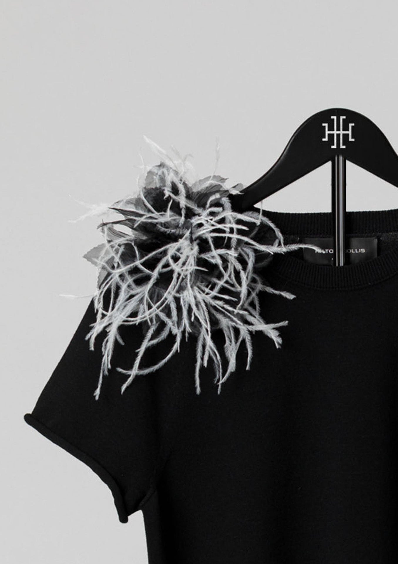 Floral brooch sold separately.